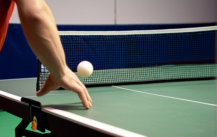 A highly detailed, cinematic close-up of a table tennis player executing a deceptive short serve. Focus on the delicate, precise wrist movement and the subtle contact with the ball, imparting heavy spin. The ball is barely clearing the net, showing a low, tricky trajectory, as if performing "the art of illusion". The player's face shows intense concentration. Soft, strategic lighting. Professional sports photography style.